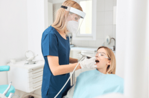 Woman in dental clinic this Covid