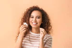 Young woman with dental floss